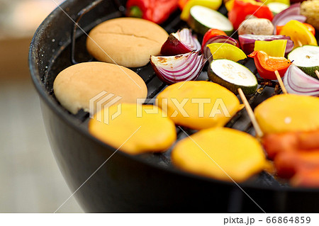 barbecue kebab meat and vegetables on grill 66864859