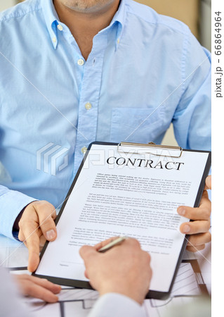 customer signing contract document at office 66864964