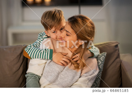 happy smiling mother and son hugging at home happy smiling mother and son hugging at home 66865185