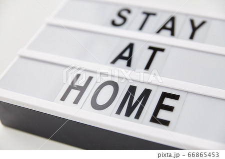 lightbox with stay at home caution words lightbox with stay at home caution words 66865453