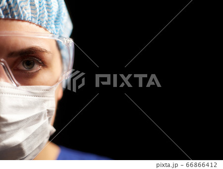 female doctor or nurse in goggles and face mask female doctor or nurse in goggles and face mask 66866412