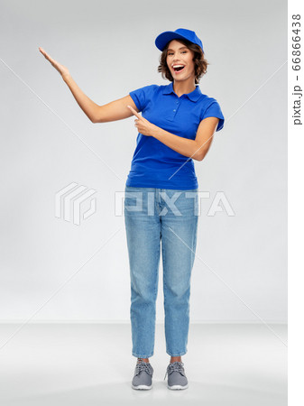 happy smiling delivery woman in blue uniform happy smiling delivery woman in blue uniform 66866438