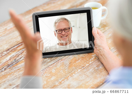 senior woman having video call with senior man 66867711