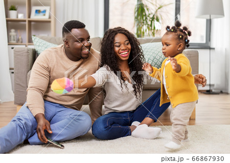 african family playing with baby daughter at home african family playing with baby daughter at home 66867930