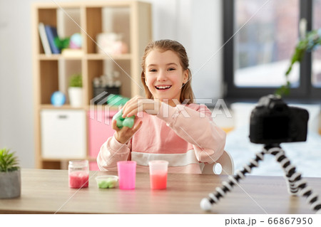 girl with slime and camera video blogging at home girl with slime and camera video blogging at home 66867950