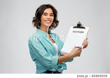 smiling woman with petition on clipboard and pen smiling woman with petition on clipboard and pen 66868008