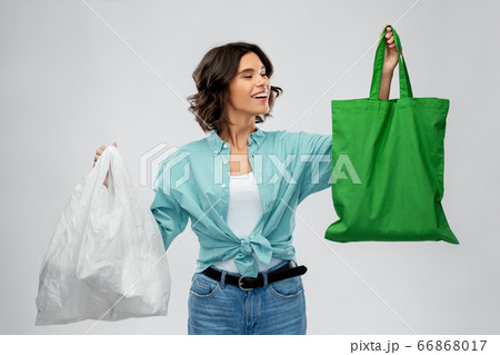 woman with plastic and reusable shopping bag woman with plastic and reusable shopping bag 66868017
