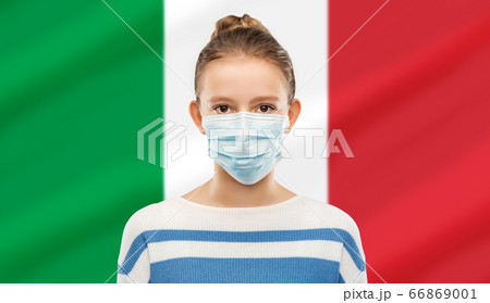 teenage girl in medical mask over flag of italy 66869001