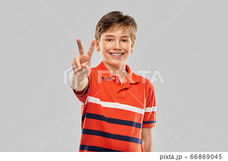 portrait of happy smiling boy in red polo t-shirt portrait of happy smiling boy in red polo t-shirt 66869045