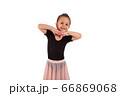 Portrait of cute little girl wearing dance suit, smiling and propping up her head with hands , isolated on white background 66869068