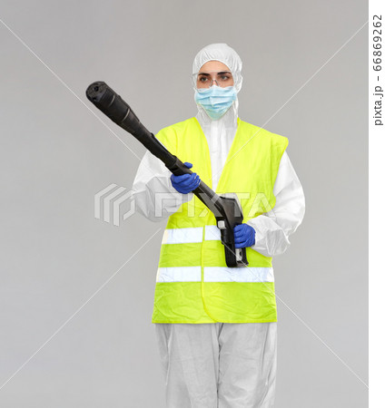 sanitation worker in hazmat with pressure washer 66869262