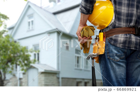 worker or builder with helmet and working tools 66869921