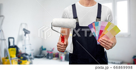 close up of painter with roller and color charts close up of painter with roller and color charts 66869998