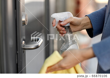 hand cleaning door handle with detergent and rag hand cleaning door handle with detergent and rag 66870106