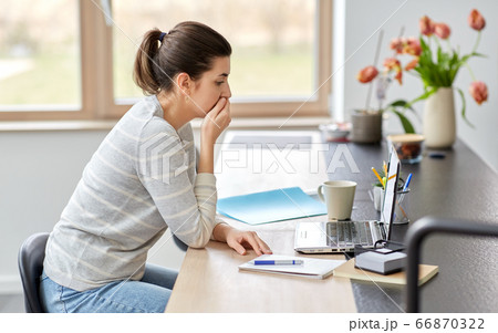woman with laptop working at home office woman with laptop working at home office 66870322