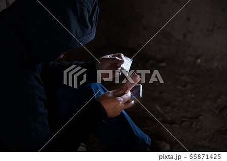Man call up sells the drugs on phone and he is addicted drug or narcotic with copy space Man call up sells the drugs on phone and he is addicted drug or narcotic with copy space 66871425