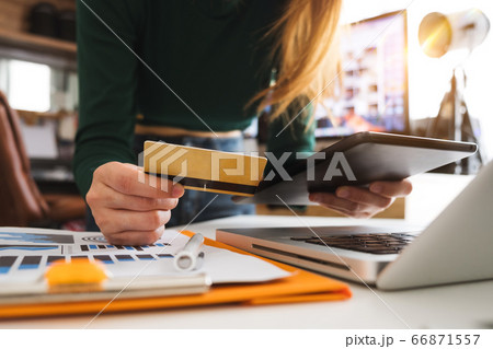 Business woman hands using smartphone and holding credit card with digital layer effect diagram as Online shopping concept 66871557
