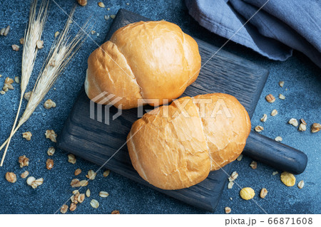 Fresh wheat bread rolls. Rolls for a hot dog or hamburger. Dark background copy space. Fresh wheat bread rolls. Rolls for a hot dog or hamburger. Dark background copy space. 66871608