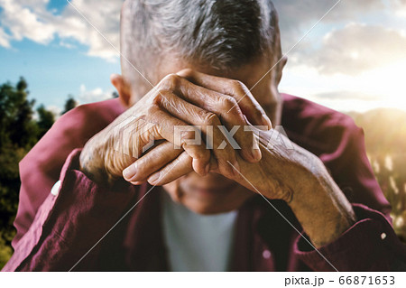 senior man covering his face with his hands. Depression and anxiety Copy space. 66871653