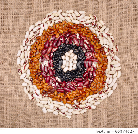 Colored beans. Variations and food circles on sack cloth 66874027