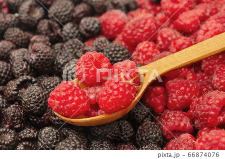 Blackberry and raspberry with wooden spoon Blackberry and raspberry with wooden spoon 66874076