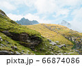 Beautiful mountain landscape with sheep on the hill 66874086