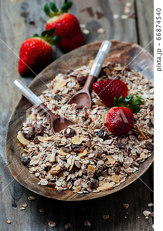 Homemade muesli with strawberry on the wooden Homemade muesli with strawberry on the wooden 66874540