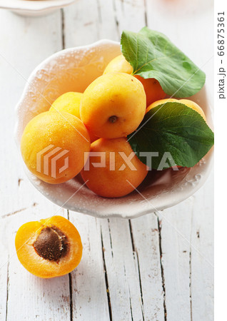 Fresh sweet apricots on the wooden table 66875361