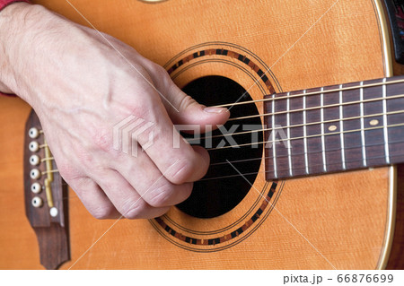 Guitar player playing acoustic guitar Guitar player playing acoustic guitar 66876699