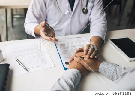 Doctor holds hands and leaves comforting 66881182