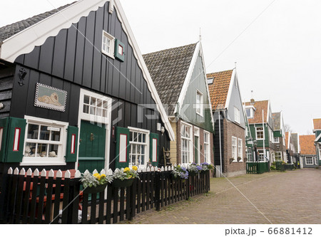 Typical Dutch village with beautiful wooden houses on the island of Marken in the Netherlands, Holland Typical Dutch village with beautiful wooden houses on the island of Marken in the Netherlands, Holland 66881412