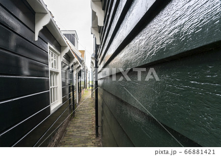 Typical Dutch village with beautiful wooden houses on the island of Marken in the Netherlands, Holland Typical Dutch village with beautiful wooden houses on the island of Marken in the Netherlands, Holland 66881421