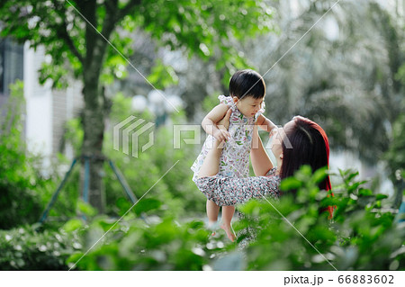 Mother and daughter outdoor having fun 66883602