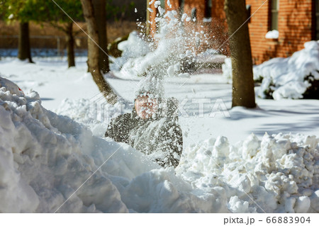 Cute little caucasian girl playing in the snow in 66883904