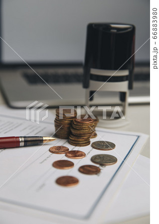 Saving money concept,graph, stacks of coins ,chart and pen ,copy space.selective focus,vintage color Saving money concept,graph, stacks of coins ,chart and pen ,copy space.selective focus,vintage color 66883980