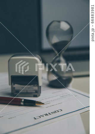 Notary public in office signing document Notary public in office signing document 66883981