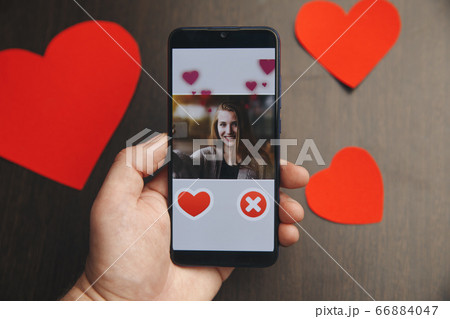 phone with red hearts on table close up 66884047