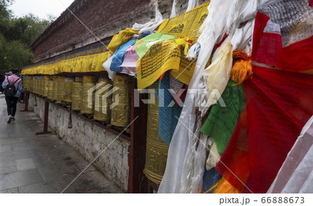 Multicolored prayer flags by the wheel wall Multicolored prayer flags by the wheel wall 66888673