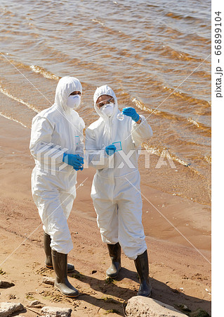 Ecologists examining the water 66899104