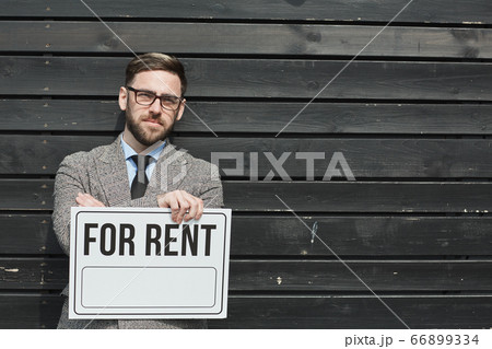 Realtor holding placard Realtor holding placard 66899334