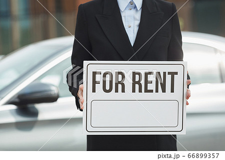 Saleswoman working in car salon 66899357