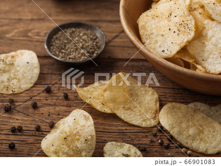 Crunchy potato crisps chips with black pepper in Crunchy potato crisps chips with black pepper in 66901083
