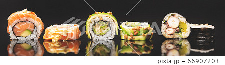 Sushi roll set on black glass background Sushi roll set on black glass background 66907203