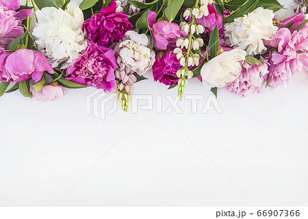 Beautiful floral frame of bunch of purple, pink, white peonies 66907366
