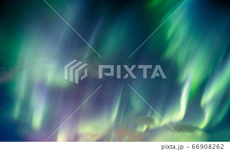 Aurora borealis, Northern lights swirl with star 66908262