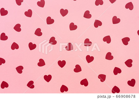 Romantic pink backround with red paper hearts 66908678