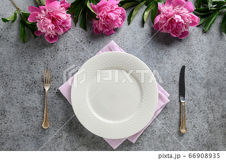 Festive table setting with pink peony 66908935
