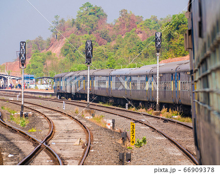 A traditional train carriage in India in transit. 66909378