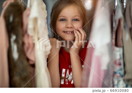Pretty girl choosing clothes Pretty girl choosing clothes 66910080