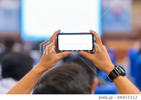 Cameraman taking Vedio to speaker on the stage present in conference hall Cameraman taking Vedio to speaker on the stage present in conference hall 66915312